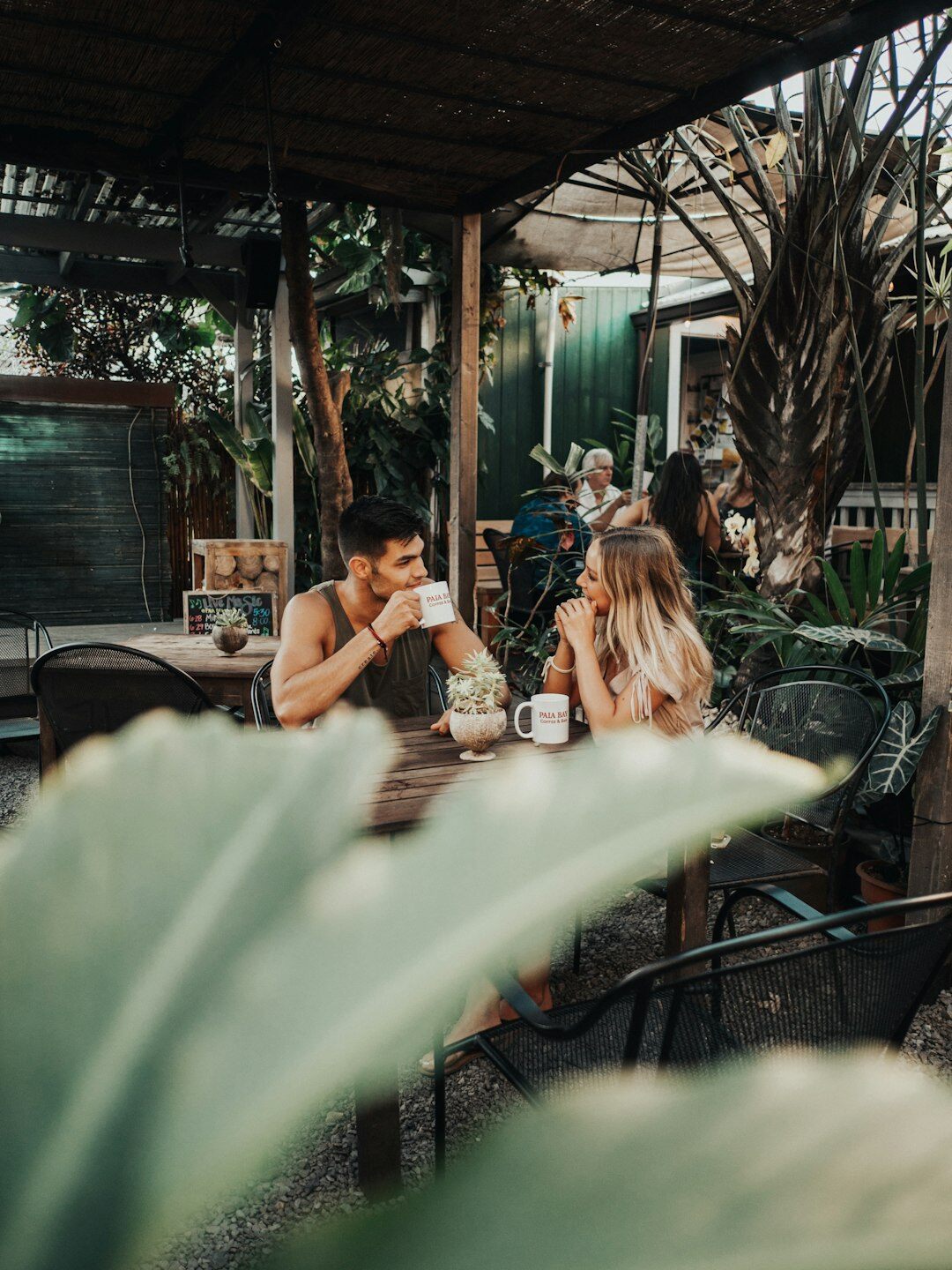 Small group of colleagues having a friendly discussion around a table